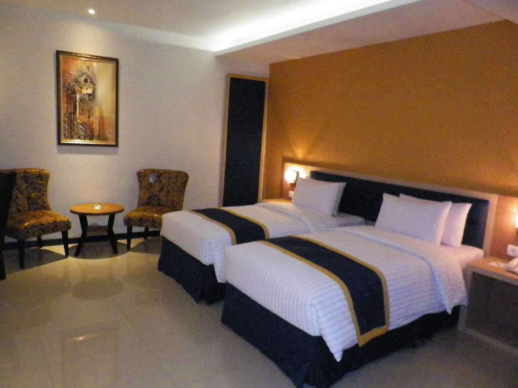 D'Best Hotel Pasar Baru Бандунг Стая снимка